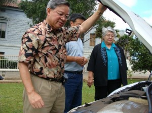 County Energy Commissioner Victor Reyes shows Mayor Tavares her new wheels. Tavares made renewable energy one of her top issues and the test program is in line with her goals for sustainability.