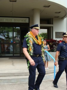 Cheif Tom Phillips (in foreground) walks alongside his Deputy and successor as he is honored during his final day of work before retirement. Photo by Wendy OSHER.