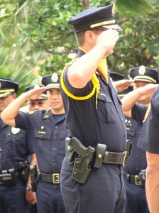 Members of the Maui Police Department stand at attention as they salute Maui's long time chief Tom Phillips on his last full day at work. Photo by Wendy OSHER.