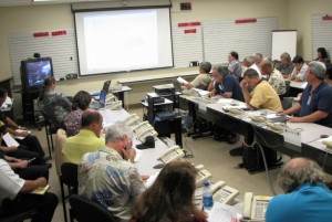 State and County officials are briefed on the track of Felicia at a briefing on Sunday at the County Emergency Operating Center. Photo Courtesy: County of Maui.
