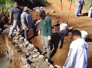 Crews work to repair a culvert damaged in wildfires and the December 2007 winter storm. File photo by Wendy Osher.