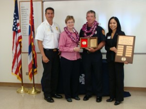 (Photo from left to right: Maui Fire Chief Jeffrey Murray, County Managing Director Sheri Morrison, Firefighter I Lawrence "Larry" Crilley, and Leilani Johnson of Liberty Mutual. Photo by Wendy Osher)