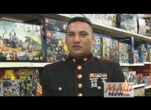 Sgt. Brandon Benz-Marrs joined island keiki in purchasing toys from the Kahului K-Mart this morning for the annual Toys For Tots fundraiser. Photo by Wendy Osher.