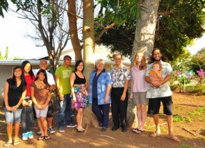 firsttimehome_full Maui Mayor Charmaine Tavares & Council Vice-Chair Michael Molina visited with several families who recently purchased their own home under the FTHBG program. L-R: Manny Visitacion and daughters Tiffany (13), Ashley (16) and Seryna (10); siblings Rudolfo Queja & Irene Queja Bala; Mayor Tavares; Councilmember Molina; Joy & Charles Au with son Makahinu, 14 mos. Photo Courtesy County of Maui.