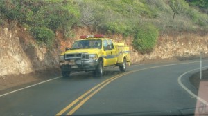 Rescue personnel respond to reports of a vehicle over the cliff on the Kahekili Highway. Photo by Wendy Osher.