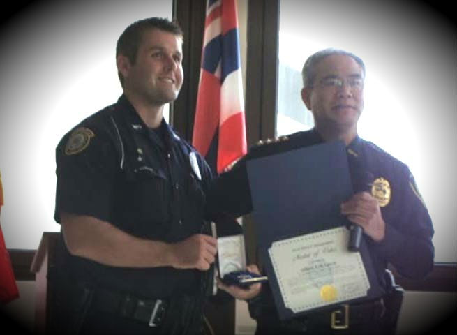 Maui Police award ceremony, Friday, Feb. 22, 2013. Pictured left is Silver Medal of Valor recipient, Erik Losvar with Maui Police Chief Gary Yabuta (right). Photo by Wendy Osher.