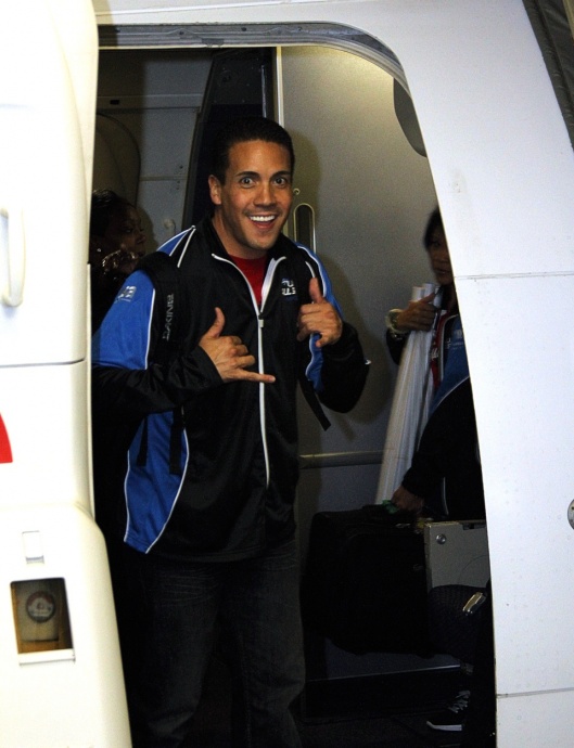 Hawaii All-Star Cheerleaders founder and head coach Kealii Molina steps off the plane first with a championship smile of course. Photo by Ben Juan.