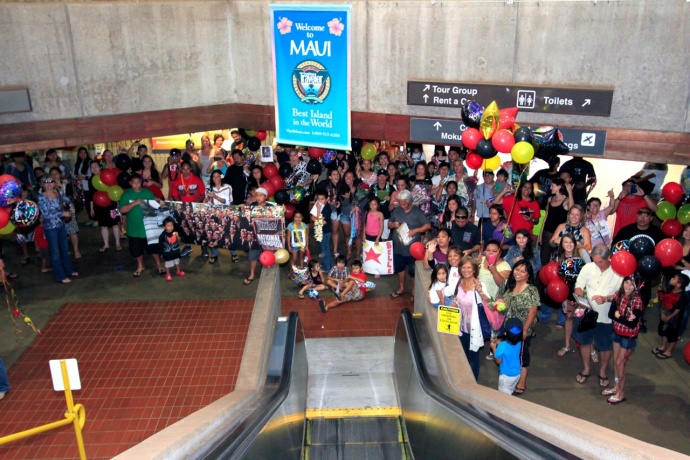 Friends and family await the arrival of the Hawaii All-Star Cheerleaders at the security gate of the Kahului Airport on Monday. Photo by Ben Juan.