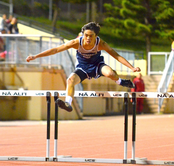 Kamehameha Maui sophomore Jesse Amaral shows his winning form in the junior varsity boys 300 hurdles. Photo by Rodney S. Yap.