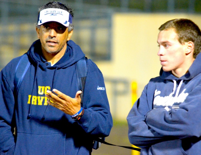 Kamehameha Schools Maui new head track coach Rudy Huber talks with junior hurdler Iain Armitage Friday after the boys 300 hurdles. Photo by Rodney S. Yap.