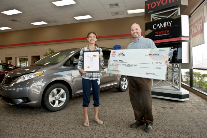 FINALIST: Oriana Buika, age 14, H.P. Baldwin High School receives $150 check from Toyota Hawaii’ David Whitney. Courtesy photo.