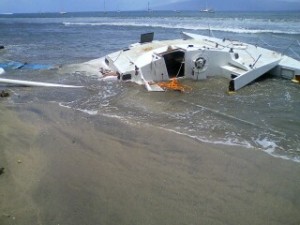 30’ sailing vessel “Caribou III” -- most of the broken pieces were quickly removed except for the mast and the mooring gear (ball and chain) which will be removed by Parker Marine when the surf subsides. The beach area is now clear. Photo courtesy Maui District Boating Office.