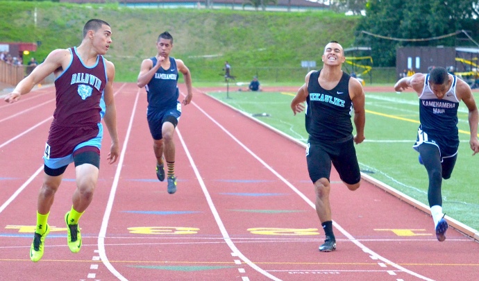 Baldwin's Keelan Ewaliko wins the 200 and looks to his left for King Kekaulike's Jay Braun and Kamehameha Maui's Jamal Jones. Ewaliko was timed in 22.16 seconds. Braun was second in 22.54 and Jones finished fifth in 22.60.