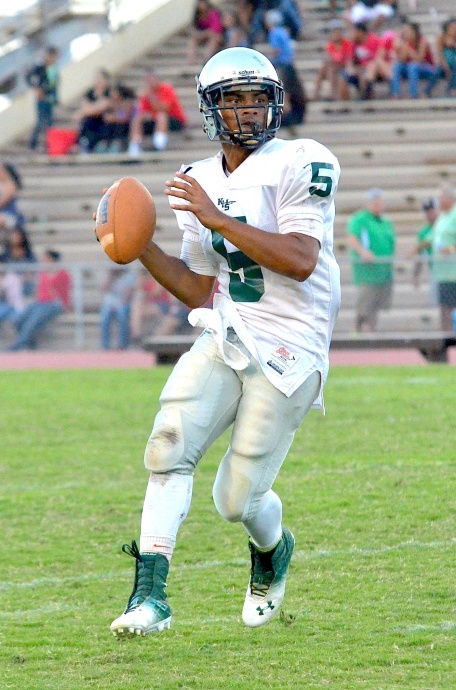 Kapaa quarterback Frenso Masaniai looks down field for an open receiver during second-half action Saturday against Lahainaluna at War Memorial Stadium. Photo by Rodney S. Yap.