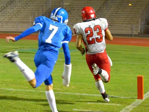 Maui High's defense and cornerback Austin Hoe (7) saw the back of Lahainaluna's Jared Rocha-Islas as he entered the end zone three times Friday. Photo by Rodney S. Yap.