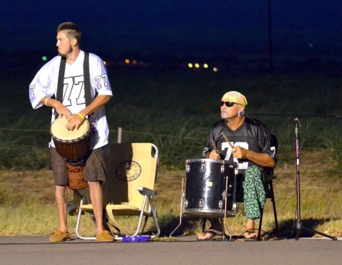 Maui Lani residents and brothers Dane (left) and Neil Sorensen decided to wake up early Sunday morning to show their support for the Maui Marathon runners. The two set up their drums and amp just the traffic light near Maui Lani golf course headed to West Maui. "We just felt like showing them some support. We're not runners, but we can appreciate what they are doing," said Neil Sorensen. Photo by Rodney S. Yap.
