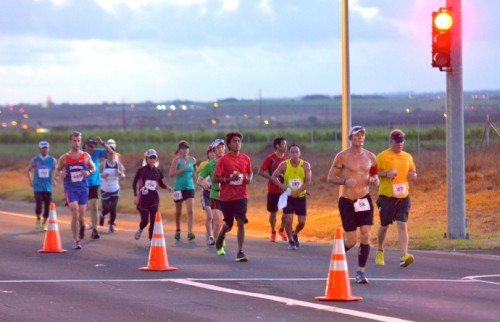 More marathon runners make their way to Kaanapali early this morning on Highway 30 near The Dunes at Maui Lani Golf Course. Photo by Rodney S. Yap.