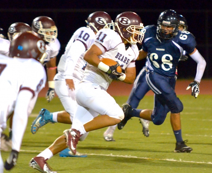 Baldwin's Nohea Keahi returns the first of his two interceptions Friday at Kamehameha Maui. Photo by Rodney S. Yap.