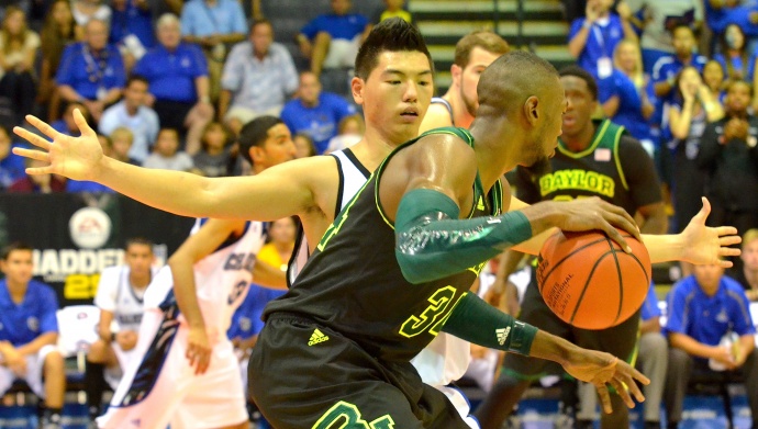 Chaminade's Kevin Hu guards Baylor's Cory Jefferson during Monday's opening round of the Maui Invitational Tournament at the Lahaina Civic Center. Photo by Rodney S. Yap.