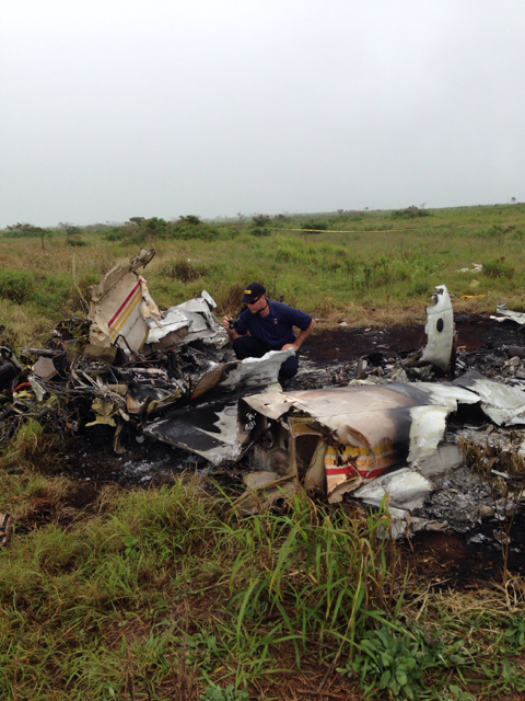 NTSB investigator Andrew Swick documents the wreckage of a Piper PA-31 that crashed in Lanai, HI, on Weds. Feb. 26. Photo courtesy NTSB.