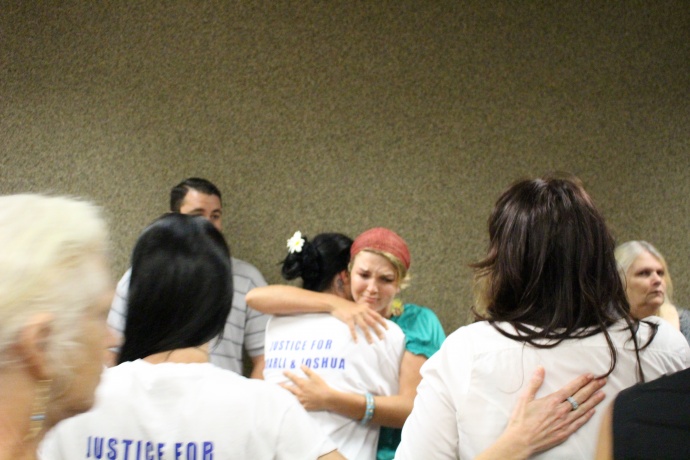 Family and friends of Carly "Charli" Scott console each other outside of the courtroom following an arraignment and plea hearing in which Steven Capobianco entered a not guilty plea to murder and arson. Photo by Wendy Osher.