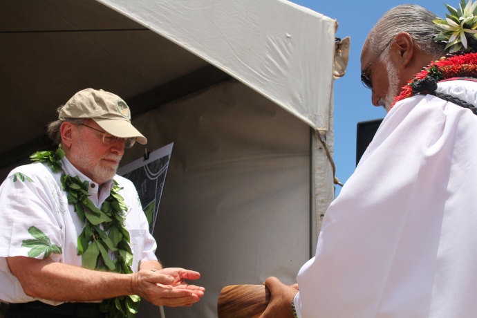 Groundbreaking of the Central Maui Regional Sports Complex, July 31, 2014. Governor Neil Abercrombie (left) washes his hands prior to the blessing led by Pastor Laki Kaʻahumanu (right). Photo by Wendy Osher.