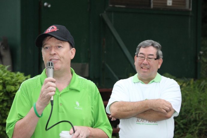 Mike O'Dwyer, owner of Mulligans on the Blue, and Reb. Msgr. Terrence A.M. Watanabe, Executive Director of Hale Kau Kau, wish the players "the luck of Irish". Courtesy file photo.
