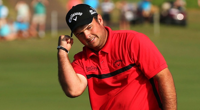 Patrick Reed celebrates after draining the winning putt to defeat Jimmy Walker in a playoff Monday. Photo by Mike Ehrmann/Getty Images.