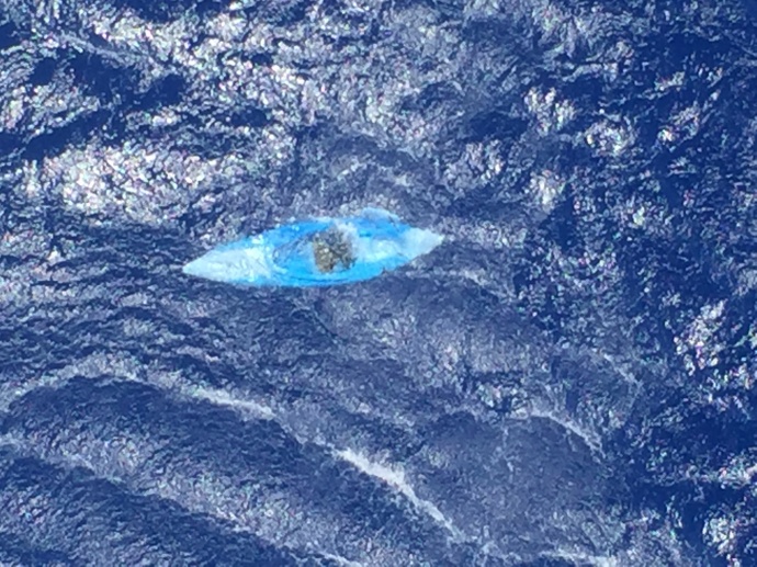 An unmanned and adrift kayak was discovered by an MH-65 Dolphin helicopter crew approximately 12 miles southwest of La’au Point, Molokai, March 29, 2015. There were no contents aboard, no discernible markings and no signs of distress in the immediate area. (Coast Guard courtesy photo)