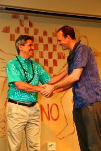 UH President David Lassner presents award to Executive Director Alex de Roode of the Sustainable Living Institute of Maui. Photo credit: Photo by Ryan Kramer.