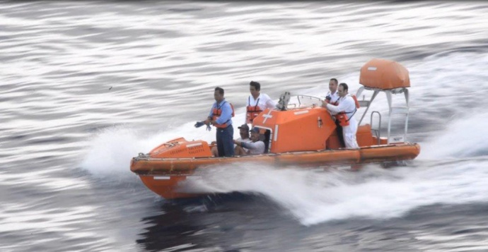 Crew members from the cruise ship Celebrity Solstice rescue two sailors after their 37-foot sailing vessel sustained severe damage when it ran aground, stranding them on a small remote island near Malden Island, Kiribati. The men were en route to Tahiti from Lanai, Hawaii, when they ran aground on a coral reef in their vessel, Hina Nui. (Courtesy photo)