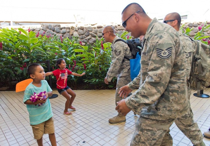 Mayor Alan Arakawa and Managing Director Keith Regan were on hand to welcome back 17 Hawaii Air National Guardsmen from the 292nd Combat Communication Squadron from a six-month deployment in the Mideast. (Photos: Ryan Piros) (7.28.2015)