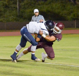 Baldwin's Aloalii Laga sacks Kamehameha Maui quarterback Kainoa Sanchez in first-half action Saturday. Photo by Rodney S. Yap.