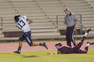 Kamehameha Maui's Maika'ike English (13) grabs this touchdown pass in the corner of the end zone Saturday against Baldwin. Photo by Rodney S. Yap.