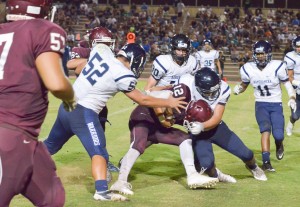 Baldwin quarterback Chayce Akaka (12) runs the ball against Kamehameha Maui Saturday. Photo by Rodney S. Yap.