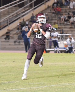 Baldwin quarterback Chayce Akaka (12) looks to throw this ball into the end zone Saturday against Kamehameha Maui. Photo by Rodney S. Yap.