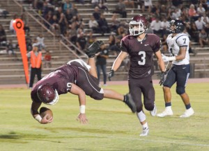 Baldwin's Chazz Sa'u vaults into the end zone Saturday after catching a tipped pass. Teammate Kaelon Wainui (3) looks on. Photo by Rodney S. Yap.