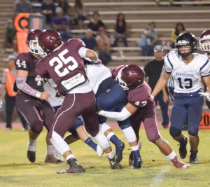Baldwin's defense was stout Saturday against Kamehameha Maui. Linebackers Damien Awai (25) and Kaohu Pua'a (43) wrap up a Warrior runner on this play. Photo by Rodney S. Yap.
