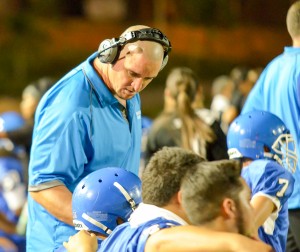 Maui High offensive coordinator Kaulana Noa talks to one of his players during a break in the action Friday. Photo by Rodney S. Yap.