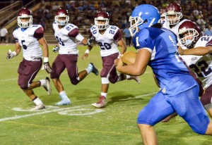 Maui High running back Soane Vaohea (1) looks at a lineup of Baldwin defenders. Photo by Rodney S. Yap.