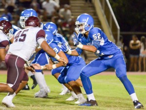 Maui High's Jamie Fisher Elisara gets ready to block Baldwin lineman Kalauga Alii Laloulu (45). Photo by Rodney S. Yap.
