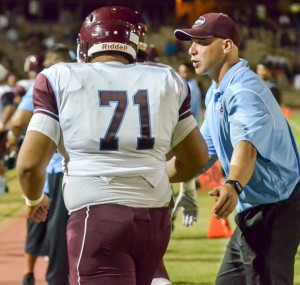 Baldwin coach Kawika Kahui and lineman Makana Wright (71) prepare to go into the locker room at halftime Friday. Photo by Rodney S. Yap.