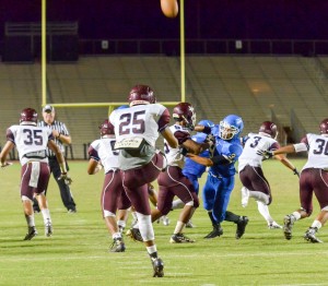 Baldwin punter Damien Awai (25) gets off this nice punt during second-half action Friday. Photo by Rodney S. Yap.