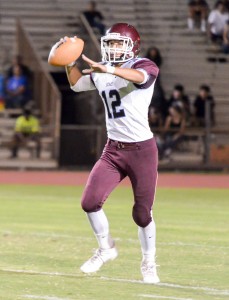 Baldwin quarterback Chayce Akaka looks for an open receiver Friday against Maui High. Photo by Rodney S. Yap.