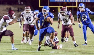 Maui High running back Soane Vaohea (1) tries to shake the tackle of Baldwin's Chris Bacos (41) near the end zone Friday. Photo by Rodney S. Yap.