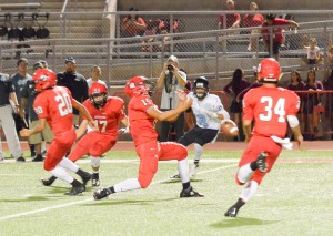 Lahainaluna's Siale Hafoka (15) can't control the ball to haul in this would-be interception. Photo by Rodney S. Yap.