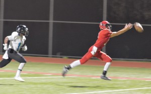 Lahainaluna's Kia Kenolio stretches for this deep ball into the end zone Saturday. Photo by Rodney S. Yap.