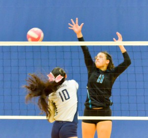 Kamehameha's Kanilea Nomura (10) hits this shot past King Kekaulike's Kekaulike's Breannalye Rodrigues (11). Photo by Rodney S. Yap.