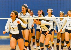 Kamehameha Maui girls volleyball team celebrates after beating King Kekaulike in four sets Friday. Photo by Rodney S. Yap.
