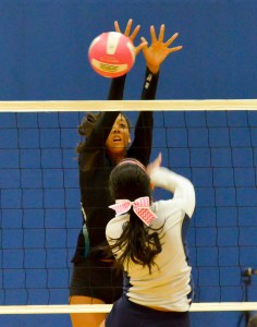 King Kekaulike's Brennalye Rodrigues (11) caps a Kamehameha Maui hitter Friday. Photo by Rodney S. Yap.